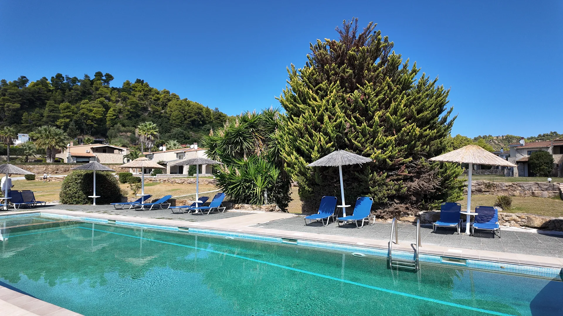 Tiara Holidays - Evlogia Village by Greek Pride - pool with sunbeds